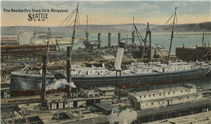 A postcard of a large ship in docked in an industrial port. Blue sky, hills, and water in the background.